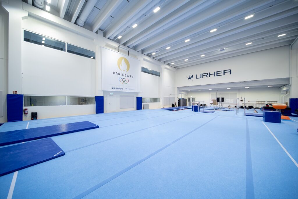 The artistic gymnastics room, Urhea and Paris 2024 logos on the walls